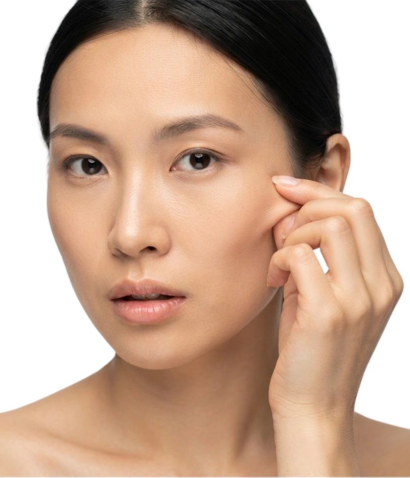 Patient gently touches her cheekbone area