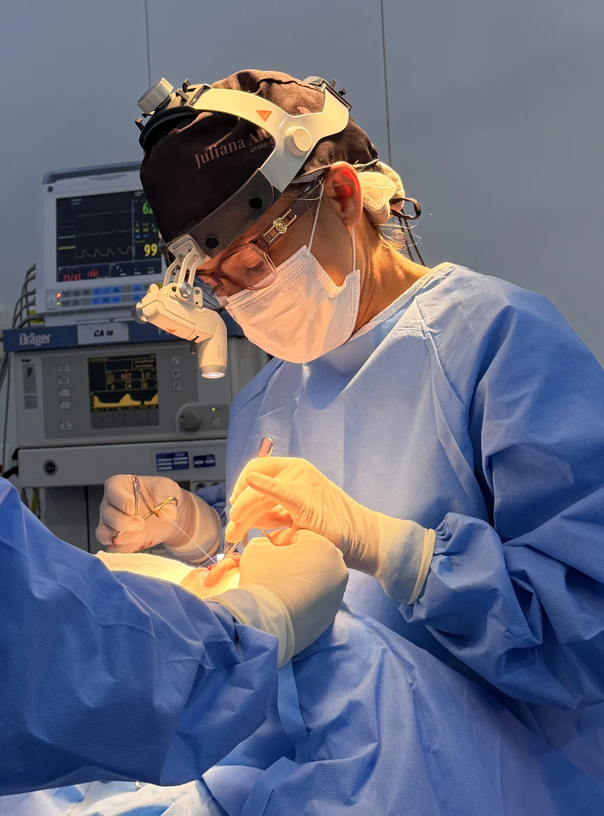 Dr. Juliana performing a surgical procedure.